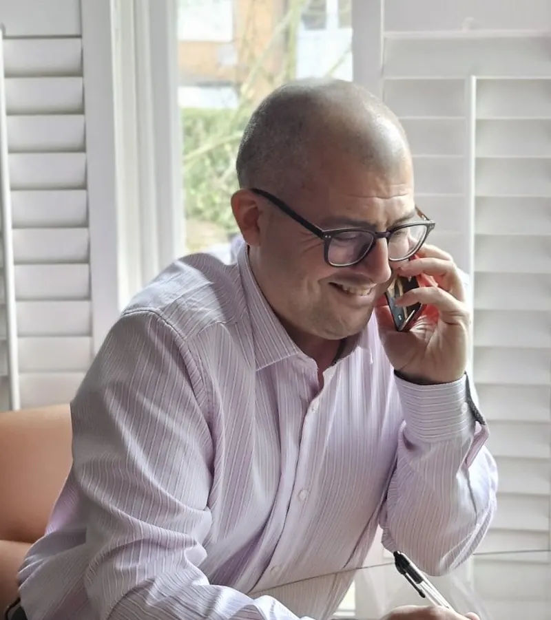 Tom Wood, Fractional Commercial Director, on a call at his desk